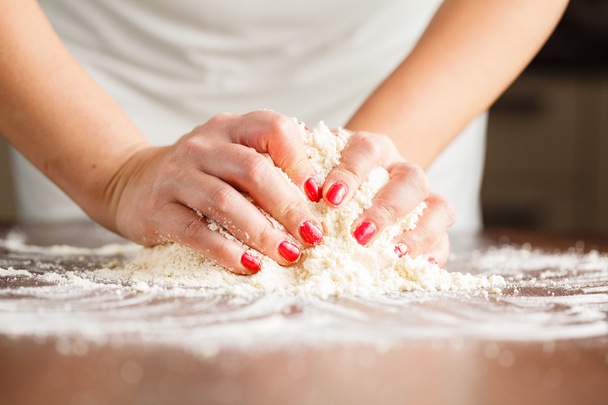 Making shortcrust pastry dough by woman's hands - Fotó, kép