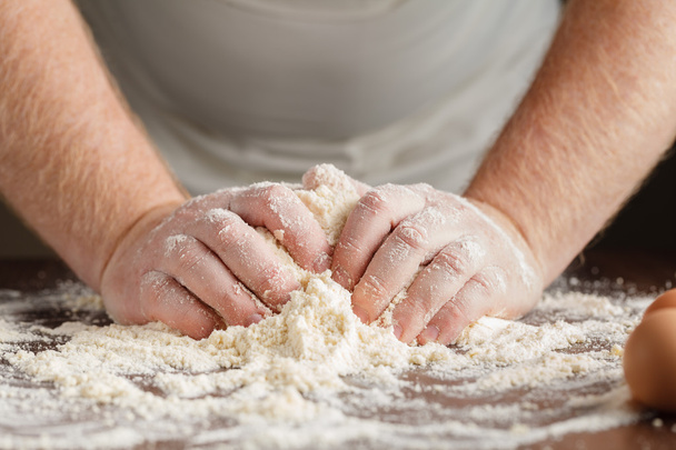 man hands kneading a dough - Фото, зображення