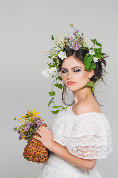 young pretty girl with flower wreath - Fotografie, Obrázek