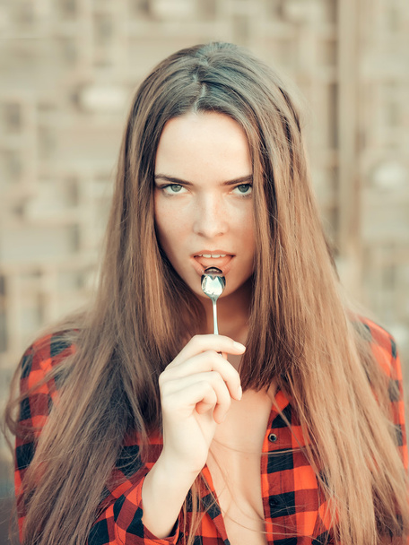 young pretty woman with tea spoon - Zdjęcie, obraz