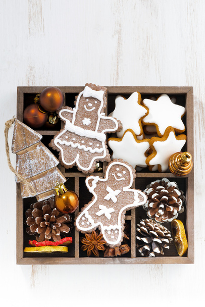 Christmas symbols in a wooden box on white table, top view - Foto, Imagen
