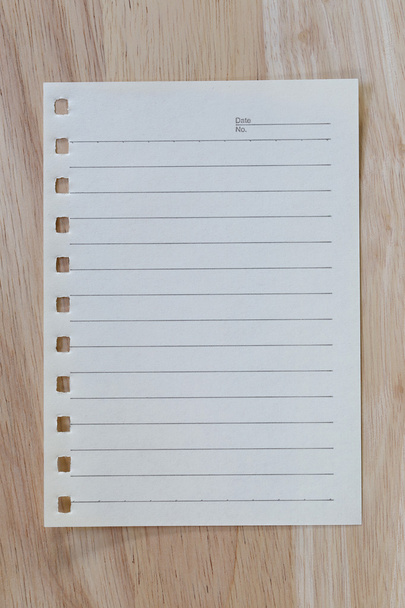 vintage of note paper on wooden background and copy specs. - Photo, Image