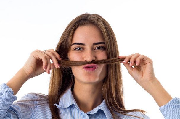 Woman making moustache with her hair - Photo, Image