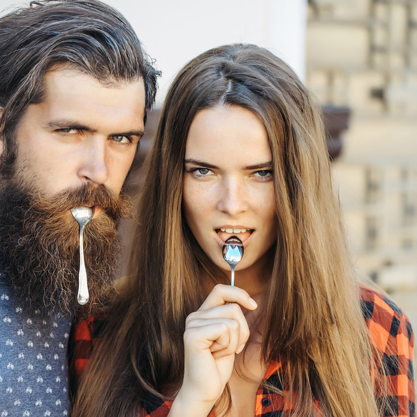 young couple with tea spoon - Fotoğraf, Görsel