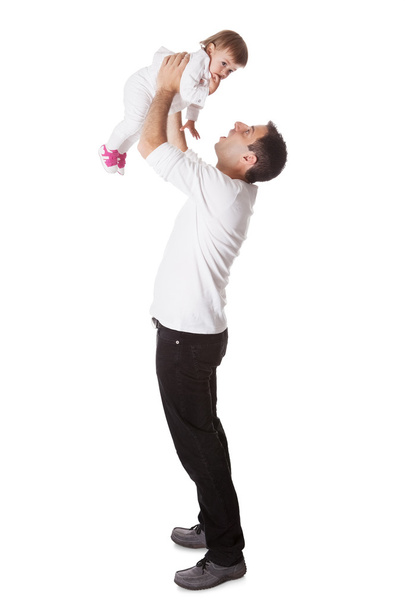 Father holding small baby aloft - Фото, изображение