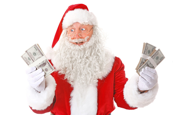 Santa Claus holding money on white background - Foto, Imagen