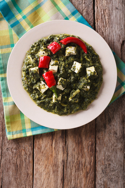 Indian Palak paneer in spicy spinach with cheese close-up. Verti - Photo, Image