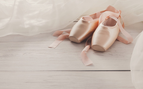 Pink ballet pointe shoes on white wood background - Photo, Image