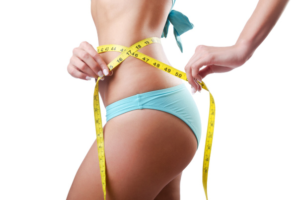 Young lady with centimetr in weight loss concept - Photo, Image