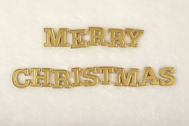 Χαρούμενα Χριστούγεννα χρυσή κείμενο σχετικά με ένα λευκό  - Φωτογραφία, εικόνα