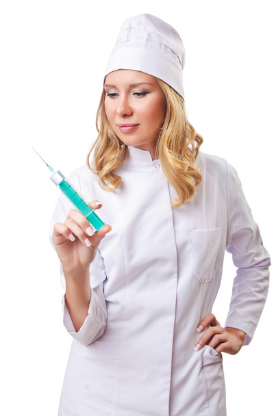 Mujer doctora con jeringa sobre blanco - Foto, Imagen