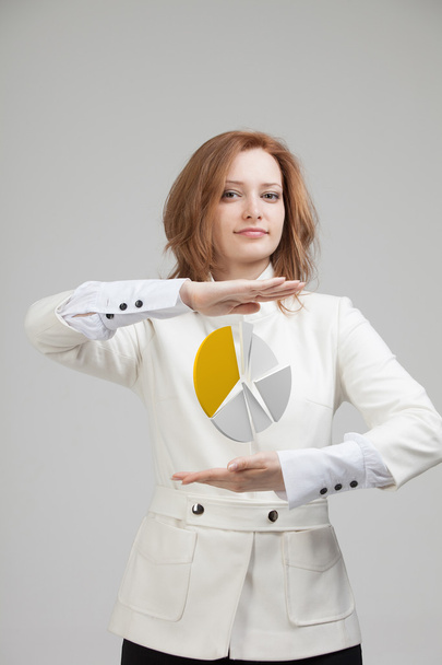 Woman shows a pie chart, circle diagram. Business analytics concept. - Foto, immagini