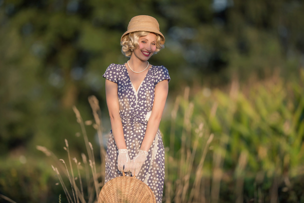 Beautiful blonde woman in rural landscape - Valokuva, kuva