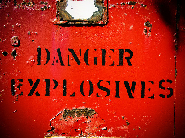 Danger explosives weathered bright red sign - Photo, Image