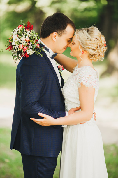 Bride and groom having a romantic moment on their wedding day - 写真・画像