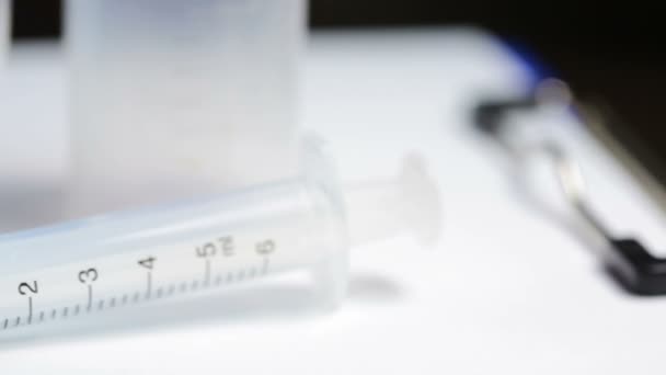 Medical test kit. syringe glasses and jar for tests - Video, Çekim