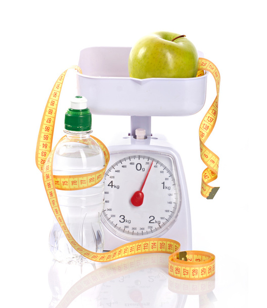weight-scales, measure, apple and bottle with aqua - Photo, image