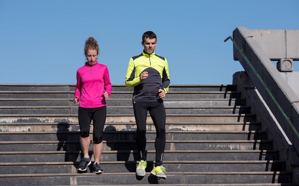 young  couple jogging on steps - Photo, image