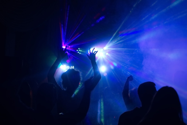 people having fun in a disco. blur effect - Photo, Image