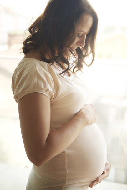 Pregnant woman at home - Photo, Image