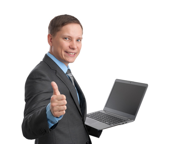 Geschäftsmann hält Laptop in der Hand und zeigt Daumen hoch - Foto, Bild