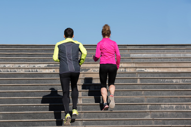 young  couple jogging on steps - Фото, зображення