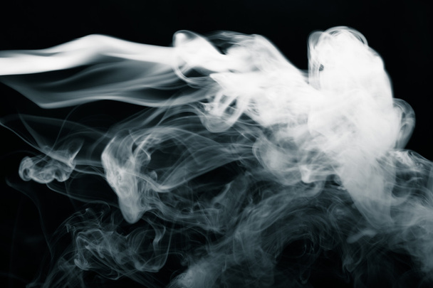 Cloud of smoke on black background. Selective focus. Toned - Fotografie, Obrázek
