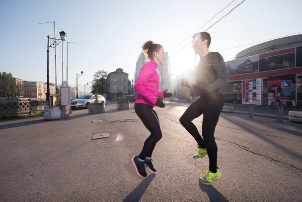 couple warming up before jogging - Фото, изображение