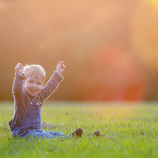 Happy child outdoor, yellow field raised his hands. Autumn, fall - Foto, Imagem