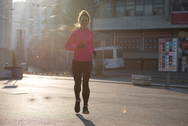 sporty woman jogging on morning - Foto, imagen