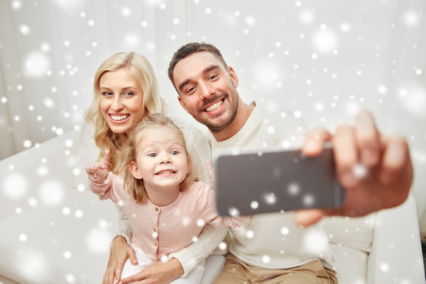family taking selfie with smartphone at home - Zdjęcie, obraz
