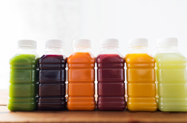 bottles with different fruit or vegetable juices - Valokuva, kuva