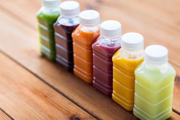 bottles with different fruit or vegetable juices - Foto, Imagem