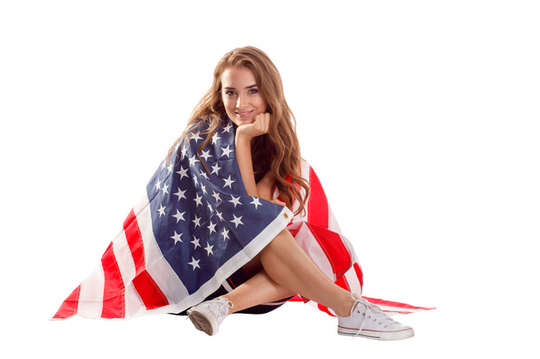 Happy patriotic woman holding USA flag. - Φωτογραφία, εικόνα
