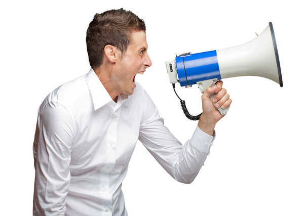 Portrait Of Young Man Shouting On Megaphone - Foto, afbeelding