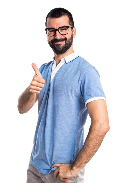 Uomo con camicia blu con pollice in su
 - Foto, immagini