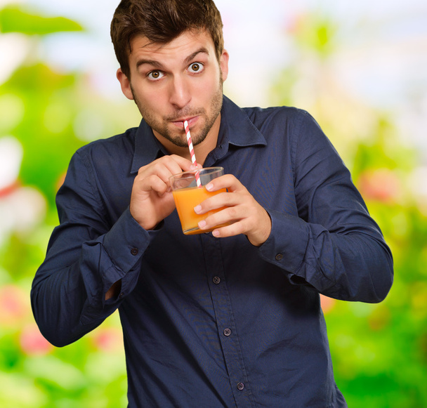 Young Man Drinking Juice - Foto, Imagen