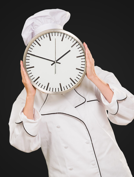 Chef escondendo rosto com relógio
 - Foto, Imagem