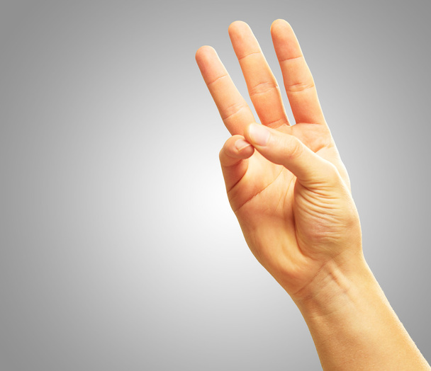 Mano humana con dos dedos apuntando hacia arriba
 - Foto, Imagen