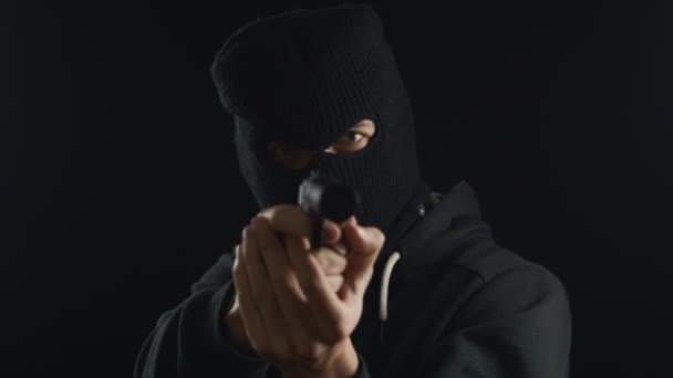 Dangerous terrorist in balaclava talking on the phone. redemption requirement. - Footage, Video