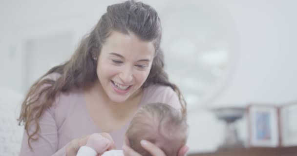 mother holding baby daughter - Filmagem, Vídeo