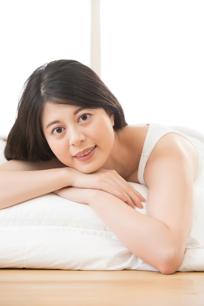 Health woman smile face to camera lying on bed morning - Foto, imagen