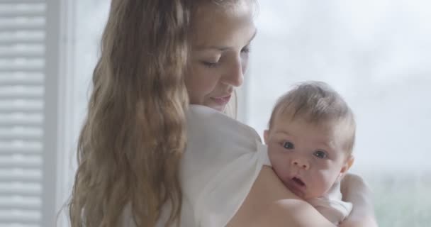 mother holding baby daughter - Кадри, відео