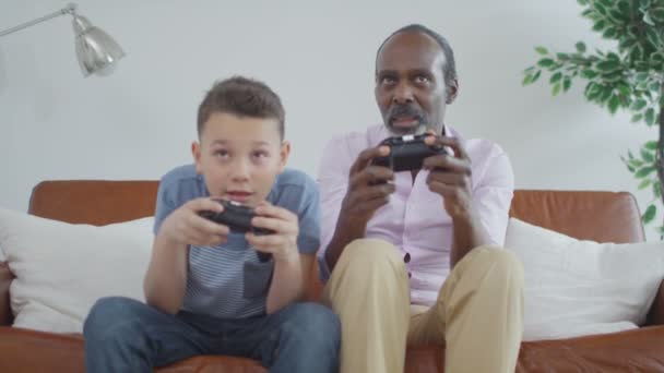 grandfather trying to play video games - Filmati, video