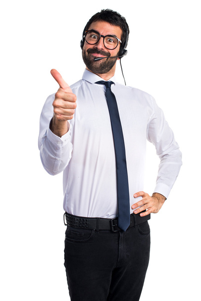 Handsome telemarketer man with thumb up - Foto, Imagen