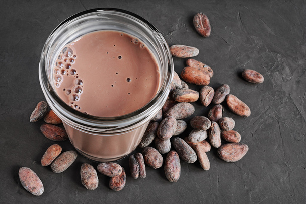Chocolate milk and cocoa beans - Photo, Image