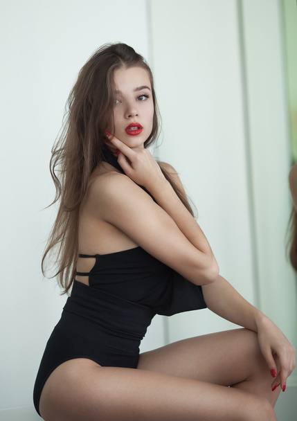Pretty young brunette lady in a fashion pose - 写真・画像