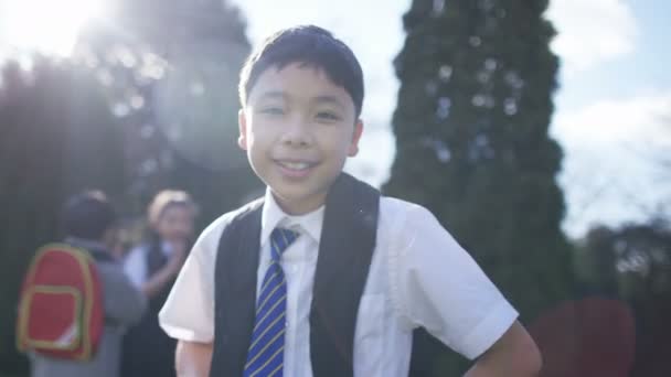 smiling little boy with backpack - Video, Çekim