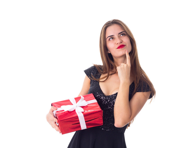Young woman holding a present - Φωτογραφία, εικόνα