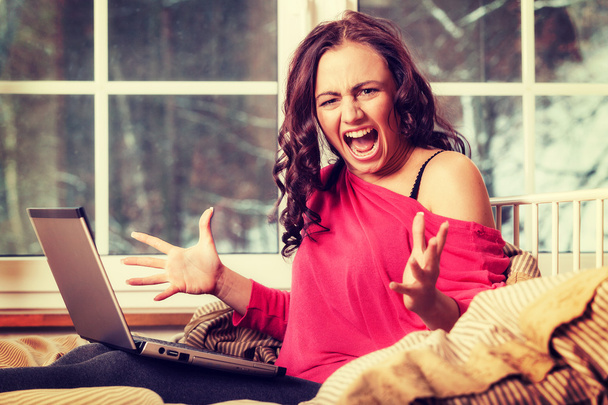 Girl screaming mad while working with the computer - Photo, Image